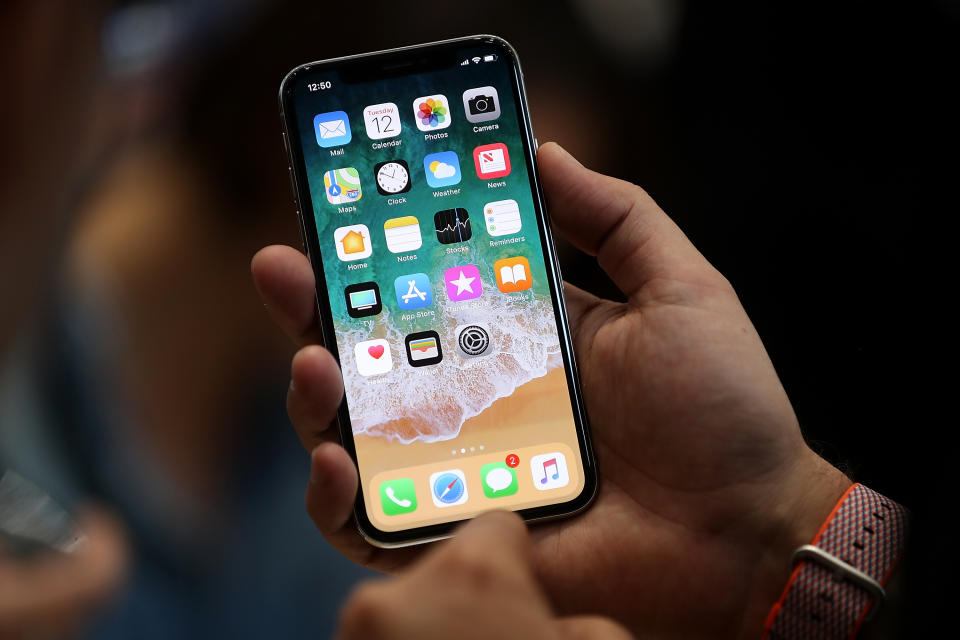 Want the latest iPhone X? Sign up for a deal to get £100 cashback. Getty Images