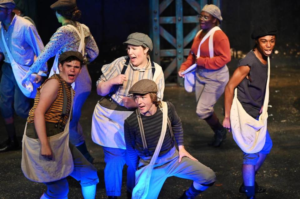 Cast members in Theatre Macon’s production of “Newsies” perform “Carry the Banner” during the first dress rehearsal on Tuesday, July 9, 2024, at Theatre Macon in Macon, Georgia. Theatre Macon’s “Newsies” will run from Friday, July 12 to Saturday, July 27.