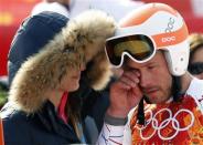 Third-placed Bode Miller (R) of the U.S. cries after the men's alpine skiing Super-G competition during the 2014 Sochi Winter Olympics at the Rosa Khutor Alpine Center February 16, 2014. REUTERS/Mike Segar