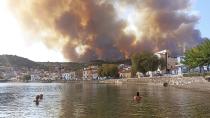 Flames burn on the mountain near Limni village on the island of Evia, about 160 kilometers (100 miles) north of Athens, Greece, Tuesday, Aug. 3, 2021. Greece Tuesday grappled with the worst heatwave in decades that strained the national power supply and fueled wildfires near Athens and elsewhere in southern Greece. As the heat wave scorching the eastern Mediterranean intensified, temperatures reached 42 degrees Celsius (107.6 Fahrenheit) in parts of the Greek capital. (AP Photo/Michael Pappas)