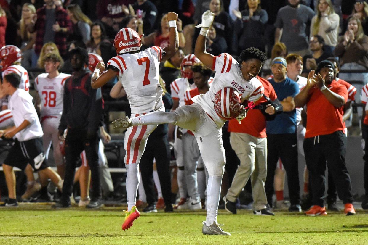 Crestview High School football players celebrate during the Bulldog's  playoff game against Niceville High School at Niceville on Friday, Nov. 11, 2022.