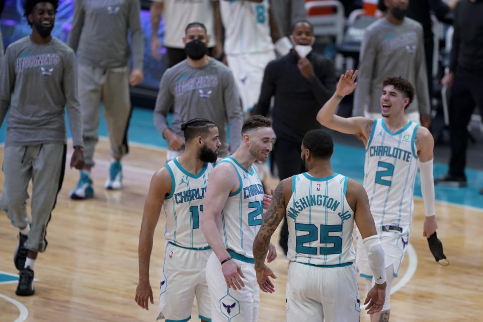 Members of the Charlotte Hornets celebrate after their win against the Sacramento Kings during the second half of an NBA basketball game on Monday, March 15, 2021, in Charlotte, N.C. (AP Photo/Chris Carlson)