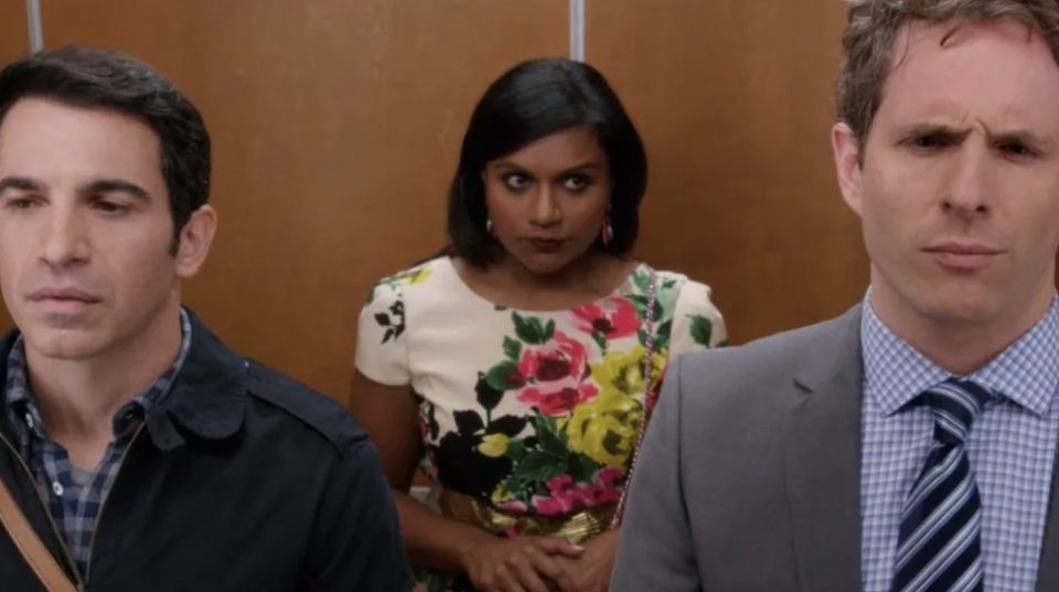 Mindy standing in an elevator with Danny and Cliff