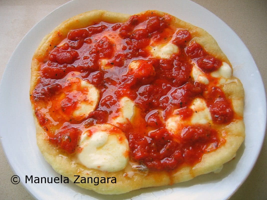 <p>Manu’s Menu</p><p>An Italian grandmother's recipe for fried pizza with tomato sauce, mozzarella and anchovies. </p><p><strong>Get the recipe: <a href="http://www.manusmenu.com/fried-pizza-pizza-fritta" rel="nofollow noopener" target="_blank" data-ylk="slk:Fried Pizza;elm:context_link;itc:0;sec:content-canvas" class="link rapid-noclick-resp">Fried Pizza</a></strong></p>