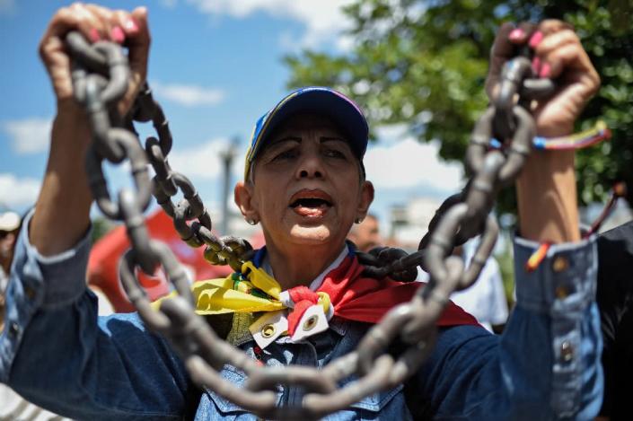 Ten people have been arrested over the alleged drone attack, including a Venezuelan opposition lawmaker whose arrested has sparked demonstrations in Caracas (AFP Photo/Federico PARRA)