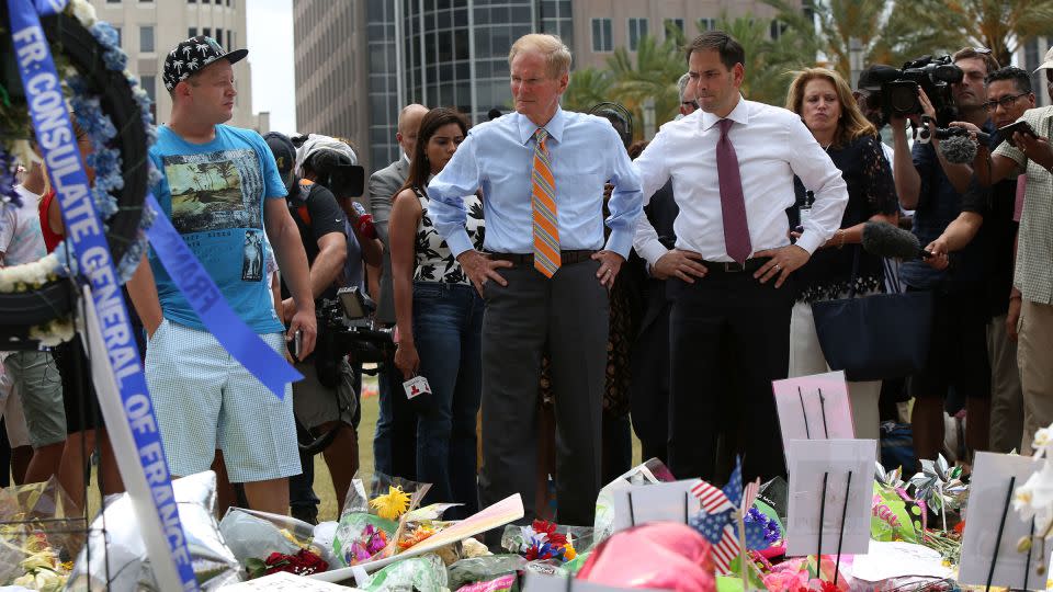 Then-Florida Sen. Bill Nelson and Sen. Marco Rubio visit the Pulse shooting victims memorial at Dr. Phillips Center for the Performing Arts in Orlando, Florida, on June 16, 2016. - Joshua Lim/Orlando Sentinel/Getty Images