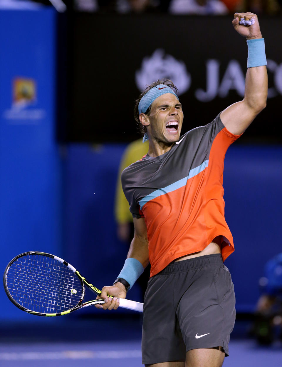 Rafael Nadal of Spain celebrates after defeating Roger Federer of Switzerland during their semifinal at the Australian Open tennis championship in Melbourne, Australia, Friday, Jan. 24, 2014.(AP Photo/Aaron Favila)