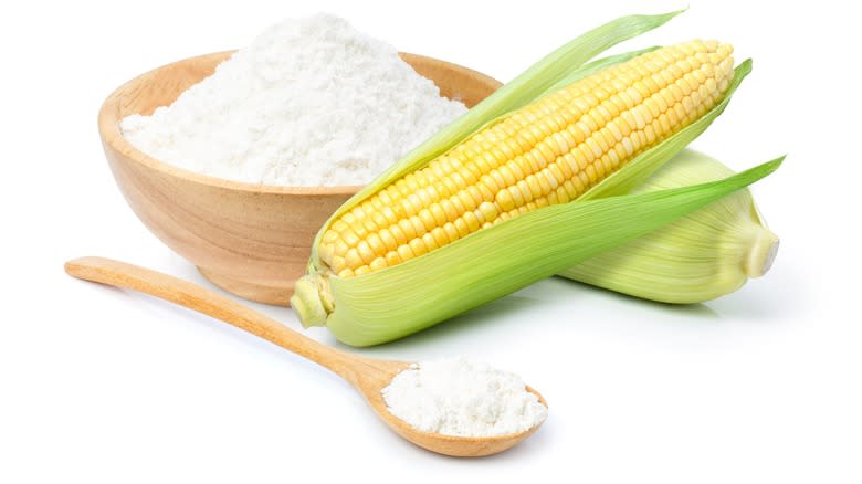 Corn and cornstarch in a bowl with spoon