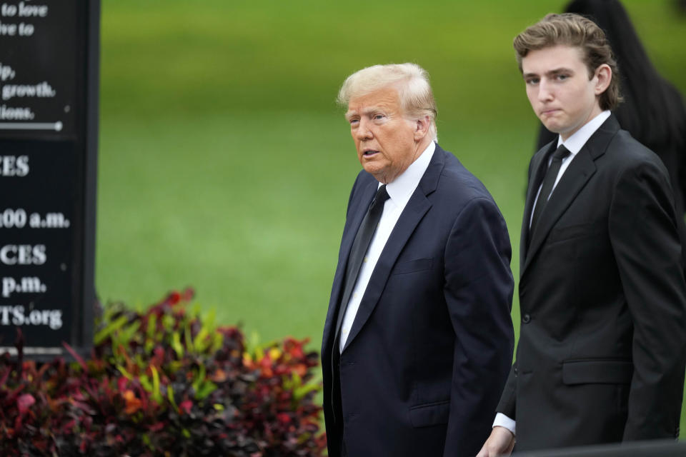 Former President Donald Trump, left, arrives with his son Barron for the funeral of the former first lady's mother at the Church of Bethesda-by-the-Sea in Palm Beach, Fla., Thursday, Jan. 18, 2024. (AP Photo/Rebecca Blackwell)