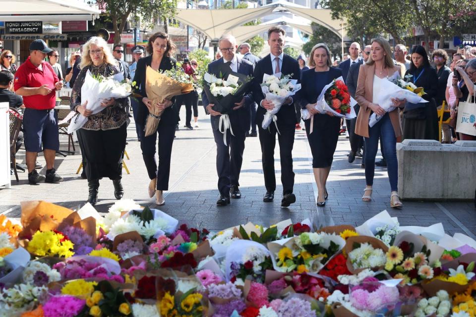 Australian prime minister Anthony Albanese and New South Wales premier Chris Minns lay floral tributes at Westfield Bondi Junction on 14 April  2024 (Getty Images)