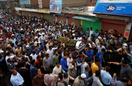 People carry the body of Syed Shujaat Bukhari, the editor-in-chief of local newspaper "Rising Kashmir", who according to local media was killed by unidentified gunmen outside his office in Srinagar, during his funeral in Kreeri, north of Srinagar, June 15, 2018. REUTERS/Danish Ismail