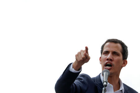 Juan Guaido, President of Venezuela's National Assembly, gestures as he speaks during a rally against Venezuelan President Nicolas Maduro's government and to commemorate the 61st anniversary of the end of the dictatorship of Marcos Perez Jimenez in Caracas, Venezuela January 23, 2019. REUTERS/Carlos Garcia Rawlins