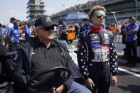 A.J. Foyt, left, talks with Santino Ferrucci during qualifications for the Indianapolis 500 auto race at Indianapolis Motor Speedway, Saturday, May 20, 2023, in Indianapolis. (AP Photo/Darron Cummings)
