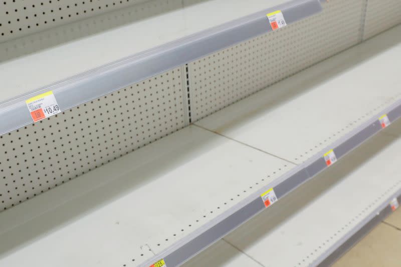 FILE PHOTO: Toilet roll shelves are seen empty in a store in Manhattan as more cases of coronavirus were confirmed in New York City