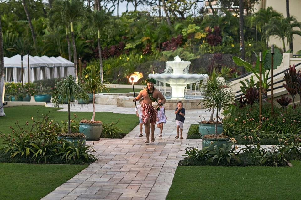 Children running around Four Seasons Resort Maui at Wailea