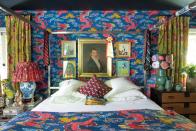 <p>Fashion designer Johnson Hartig enveloped his own bedroom in an unexpected, gutsy dragon print (Magical Ming Dragon), creating an over-the-top wonderland you never want to leave. Caponigro describes this no-holds-barred approach of decorating as "unconventional" in her book. </p>