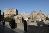 People walk in the old quarter of Sanaa