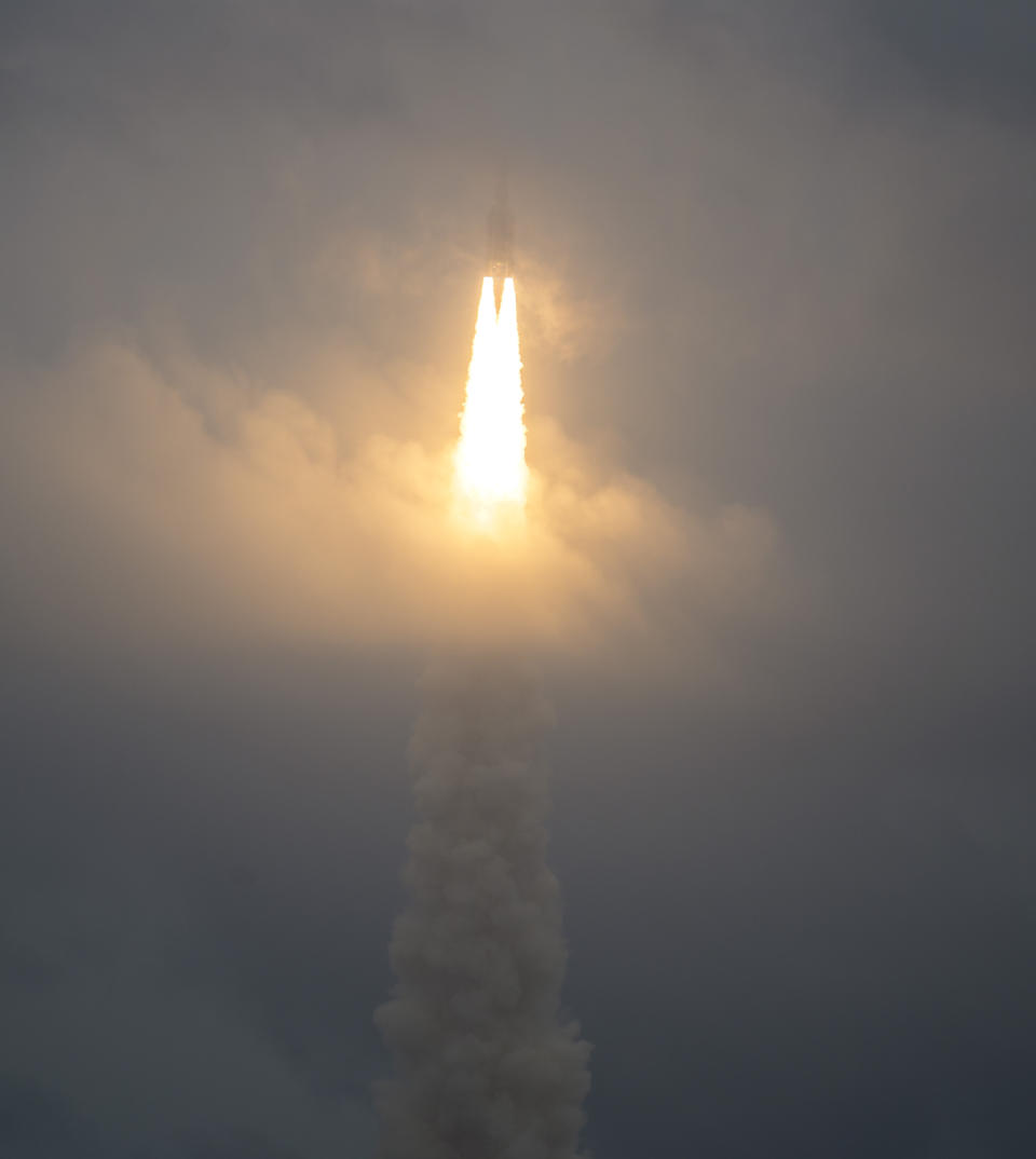 In this image released by NASA, Arianespace's Ariane 5 rocket with NASA's James Webb Space Telescope onboard, lifts off Saturday, Dec. 25, 2021, at Europe's Spaceport, the Guiana Space Center in Kourou, French Guiana. The $10 billion infrared observatory is intended as the successor to the aging Hubble Space Telescope. (Bill Ingalls/NASA via AP)