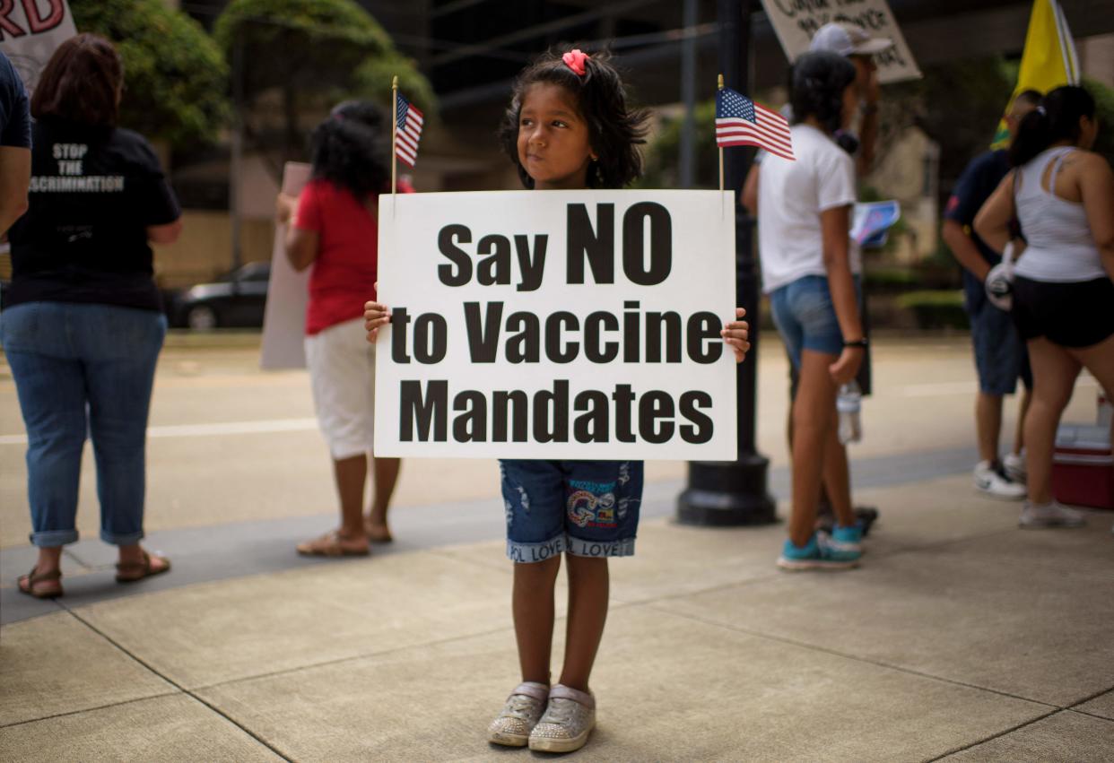 Anti-vaccine rally protester