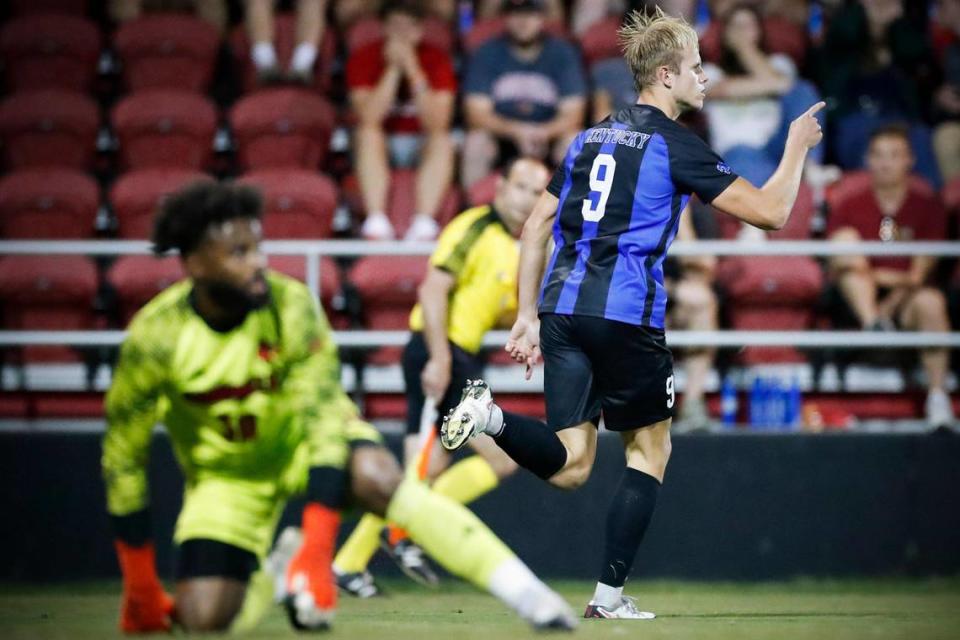 Kentucky forward Eythor Bjorgolfsson (9) celebrated a score against Louisville goalkeeper Detre Bell (30) during a match at Lynn Stadium in Louisville on Sept. 7. UK is still undefeated this season and has won five of its six games played.