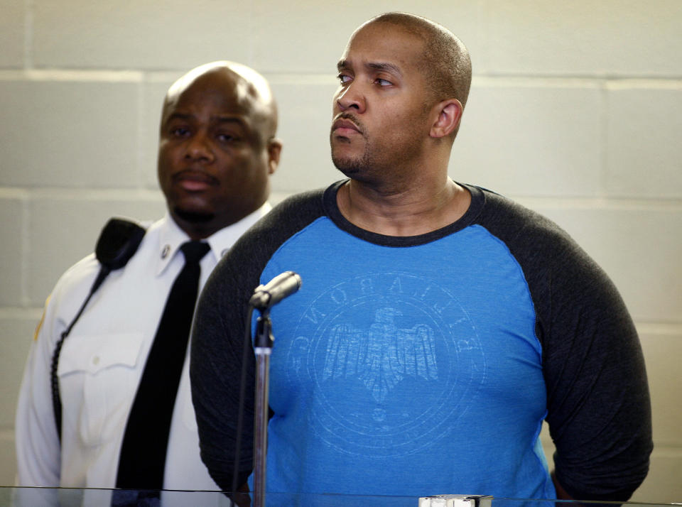 Gai Scott, right, of Randolph. Mass., stands during an arraignment, Monday, March 31, 2014, in Plymouth, Mass. Scott was arraigned on charges in the shooting of his uncle and reality TV star Benzino, who was shot Saturday during a funeral procession. (AP Photo/The Patriot Ledger, Greg Derr, Pool)