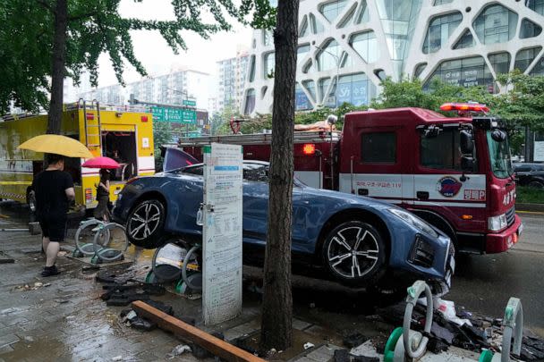 PHOTO: A vehicle sits damaged on a road after floating in heavy rainfall in Seoul, South Korea, on Aug. 9, 2022. (Ahn Young-joon/AP)