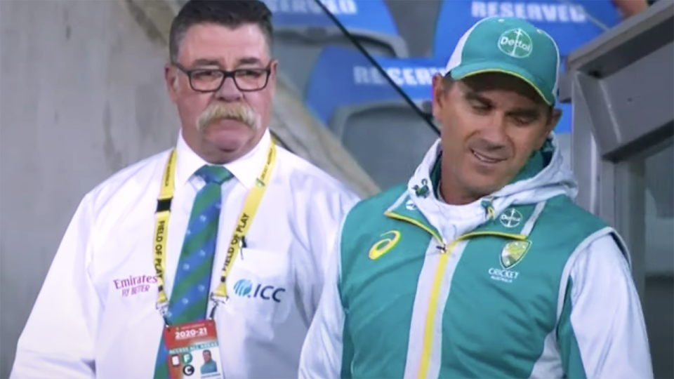 Australian coach Justin Langer walks away from Match Referee David Boon.