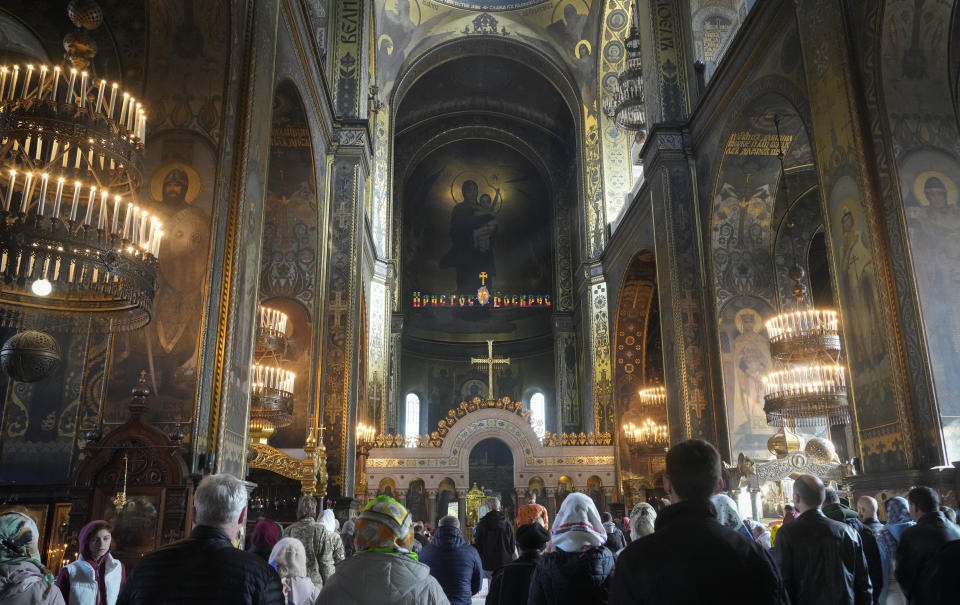 People attend a service at the Volodymysky Cathedral during Easter celebration in Kyiv, Ukraine, Sunday, Apr. 24, 2022. (AP Photo/Efrem Lukatsky)