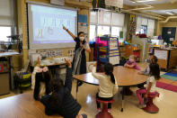 First grade teacher Suzy Tom leads a class at the Alice Fong Yu school in San Francisco, Tuesday, Aug. 30, 2022. The school is the nation's first Chinese immersion public school and provides Cantonese instruction from kindergarten until the 8th grade. While Cantonese may be on a downward trajectory, it's not dying. Online campaigns, independent Chinese schools and Cantonese communities in and outside of Chinatowns are working to ensure future generations can carry it forward. (AP Photo/Eric Risberg)