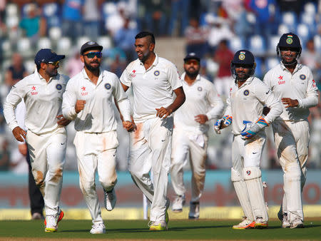 Cricket - India v England - Fourth Test cricket match - Wankhede Stadium, Mumbai, India - 8/12/16. India's players celebrate the wicket of England's Jonny Bairstow. REUTERS/Danish Siddiqui