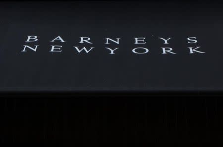 The sign on an awning of a Barneys New York retail store is seen in New York October 24, 2013. REUTERS/Eric Thayer