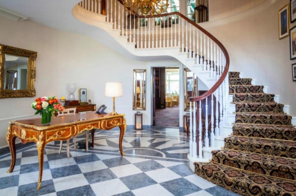 The entrance to the manor with a spiral staircase. Trump National Golf Club