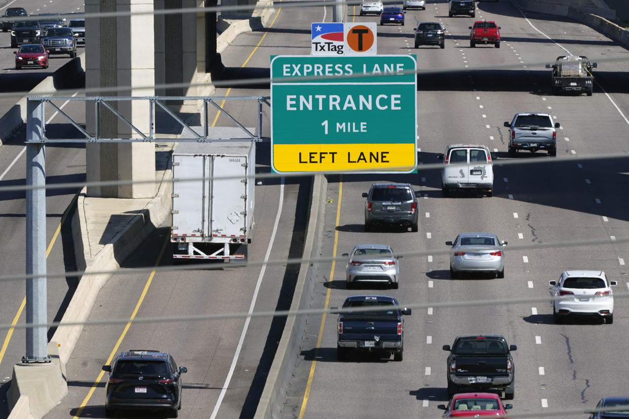 Drivers make their way on an a split highway in Irving, Texas, Friday, March 3, 2023. There is growing interest in the South in fee-based express lanes in which some drivers can up to avoid congestion on highways where other drivers can access general lanes for free. (AP Photo/LM Otero)