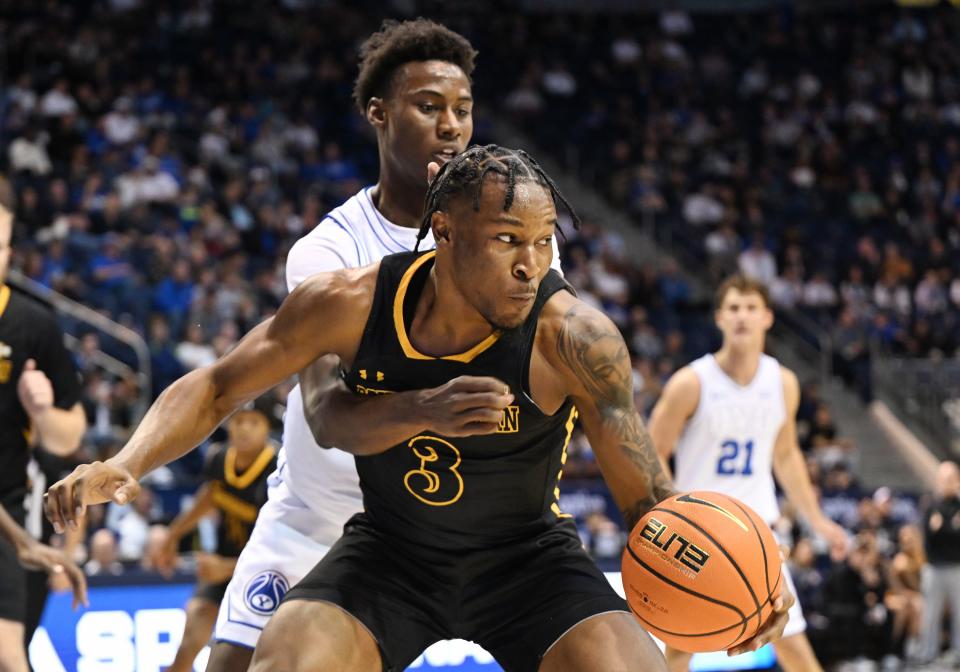 Brigham Young Cougars guard Jaxson Robinson (2) is hit with a foul on Southeastern Louisiana Lions guard Roger McFarlane (3) as BYU and SE Louisiana play at the Marriott Center in Provo on Wednesday, Nov. 15, 2023. | Scott G Winterton, Deseret News