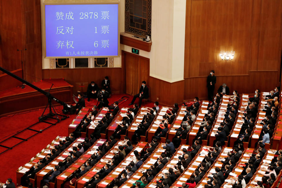 A screen shows the results of the vote on the national security legislation for Hong Kong Special Administrative Region at the closing session of the National People's Congress (NPC) at the Great Hall of the People in Beijing, China May 28, 2020. REUTERS/Carlos Garcia Rawlins