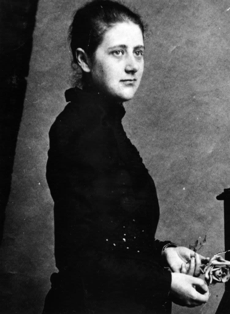 a black and white portrait of Beatrix Potter