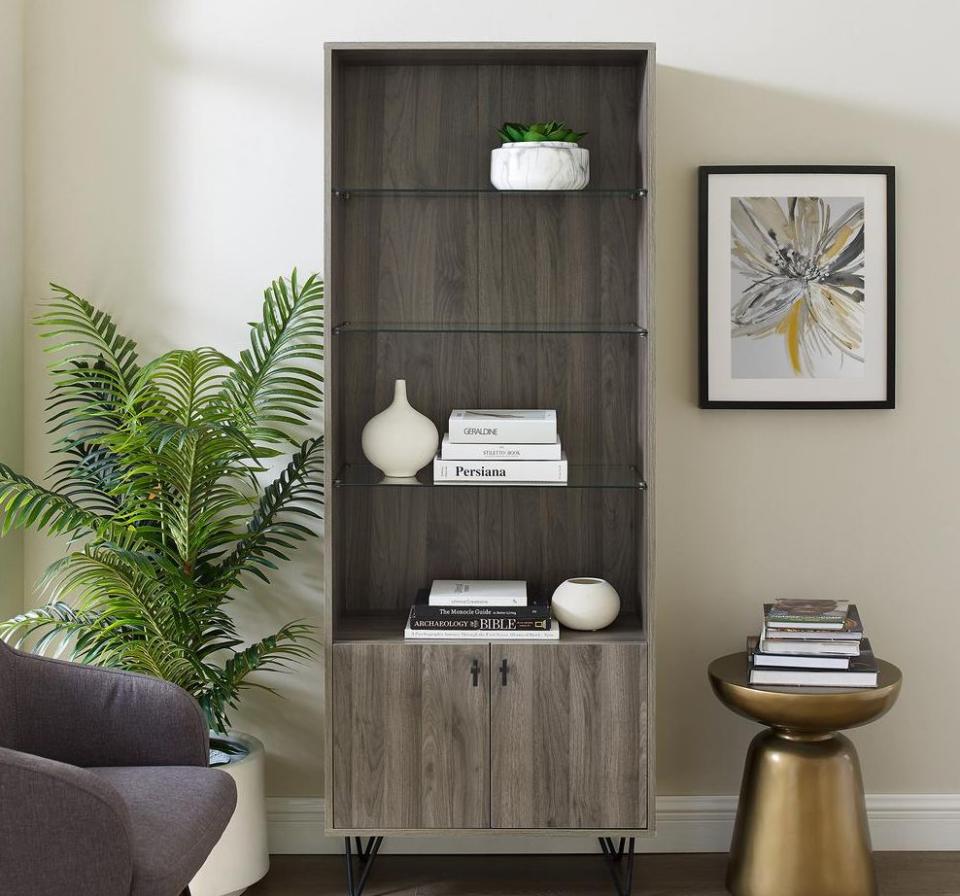 Featuring glass shelves and doors for anything you want to tuck away, this cabinet has tons of storage for vases, books and trinkets from trips. You can also use it for dinnerware, if you need the extra room. <a href="https://fave.co/3ohQCIq" target="_blank" rel="noopener noreferrer">Originally $227, get it now for $176 at The Home Depot</a>.