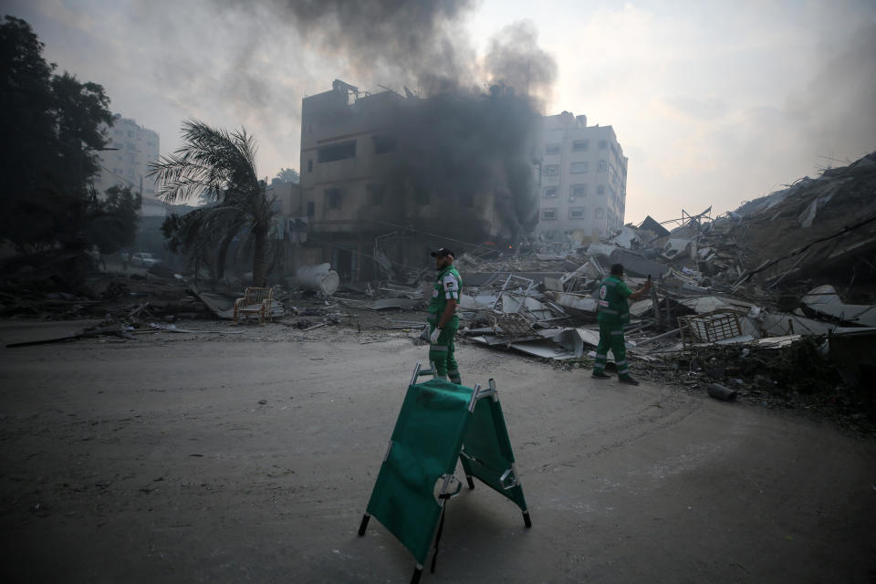 Palestinians gather next to the ruins of Watan Tower, which was destroyed in Israeli strikes, in Gaza City, Gaza Strip, Oct. 8, 2023. / Credit: Majdi Fathi/NurPhoto/Getty