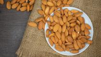 <p> Almonds aren&#x2019;t just a good, low-fat source of protein that can help to stabilize blood sugar as part of a balanced diet. It also contains magnesium, tryptophan, an amino acid that plays a central role in the production of serotonin, and large amounts of melatonin.&#xA0;<a href="https://go.redirectingat.com/?id=92X148&amp;xcust=t3_gb_2213869009478467600&amp;xs=1&amp;url=https%3A%2F%2Flink.springer.com%2Farticle%2F10.1007%2Fs11418-015-0958-9&amp;sref=https%3A%2F%2Fwww.t3.com%2Ffeatures%2Ffoods-to-help-you-sleep" rel="nofollow noopener" target="_blank" data-ylk="slk:One study" class="link ">One study</a>&#xA0;found that feeding rats 400mg of almond extract led to them sleeping longer and more deeply. </p> <p> If you do crave a late-night snack, then, almonds are a far better choice than sugary or fatty alternatives. If you&#x2019;re not a fan though, other nuts such as walnuts, pistachios and cashews have similar qualities, as do seeds such as flax seeds, pumpkin seeds, and sunflower seeds. </p>