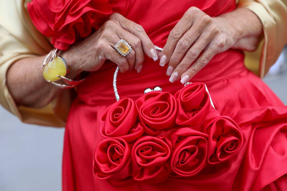 Karen Smith found her rose purse on Temu for Kentucky Derby 150 at Churchill Downs in Louisville, Ky., Saturday, May 4, 2024. It went with her red and gold outfit. Her nails were done by Nail Envogue in Lexington. Amy Wallot