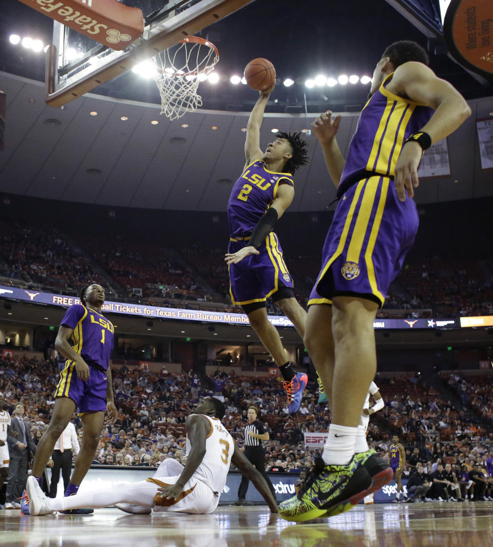 LSU forward Trendon Watford (2) scores over Texas guard Courtney Ramey (3) during the first half of an NCAA college basketball game, Saturday, Jan. 25, 2020, in Austin, Texas. (AP Photo/Eric Gay)