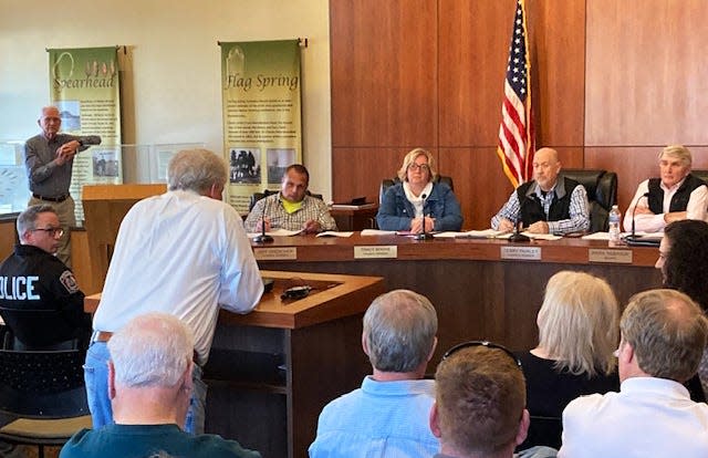 During the Village of Newtown council meeting, Thursday, March 14, 2024, several people spoke in support of Police Chief Tom Synan, lower left. Synan, the long-time police chief, is suing the village and its mayor for years-long “vendetta” targeting the chief. It alleges Mayor Mark Kobasuk engaged in “relentless harassment, bullying, retaliation and defamation” against Synan. The complaint was filed in Hamilton County Common Pleas Court.