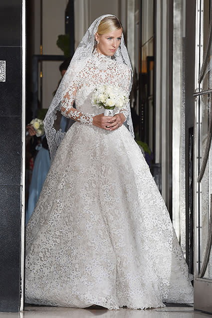 This has to be one of the best celebrity wedding dresses we've ever seen. Nicky Hilton looked gorgeous in a lacy, long-sleeved Valentino Couture wedding gown on Friday, as she stepped out of her London hotel headed to marry banking heir James Rothschild at Kensington Palace. FameFlynet <strong>PHOTOS: Beautiful Brides -- The Best Celebrity Wedding Dresses</strong> FameFlynet Check out the 31-year-old socialite's amazing train. FameFlynet Nicky had quite the hand in designing the gown as well. "Ever since I was a little girl I wanted Valentino to design my wedding dress. Valentino is the definition of timeless elegance, I don't think there's another couture house like it," she told Harper's Bazaar. <strong> WATCH: Nicky Hilton Marries James Rothschild in Lavish Ceremony </strong> "I went through every look from their collections over the last 10 years," she added. "I studied the archives, and I just sent notes about details I liked -- a certain sleeve, a high neckline." Valentino And the result -- six months later! -- is absolutely stunning: a custom couture gown with guipure lace, crystal embellishments, a balloon skirt and a nearly 10-foot train. The bride completed her look with a pair of white Christian Louboutins, inscribed with "Mrs. Rothschild." <strong>WATCH: Oops! Nicky Hilton Bares Her Butt in Serious Versace Wardrobe Malfunction</strong> Check out another memorable celebrity wedding dress -- Angelina Jolie's Versace gown when she married longtime love Brad Pitt last September -- in the video below.