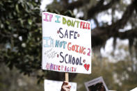 <p>An activist holds up a placard during a rally at the Florida state Capitol building to address gun control on Feb. 21, 2018 in Tallahassee, Fla. (Photo: Don Juan Moore/Getty Images) </p>