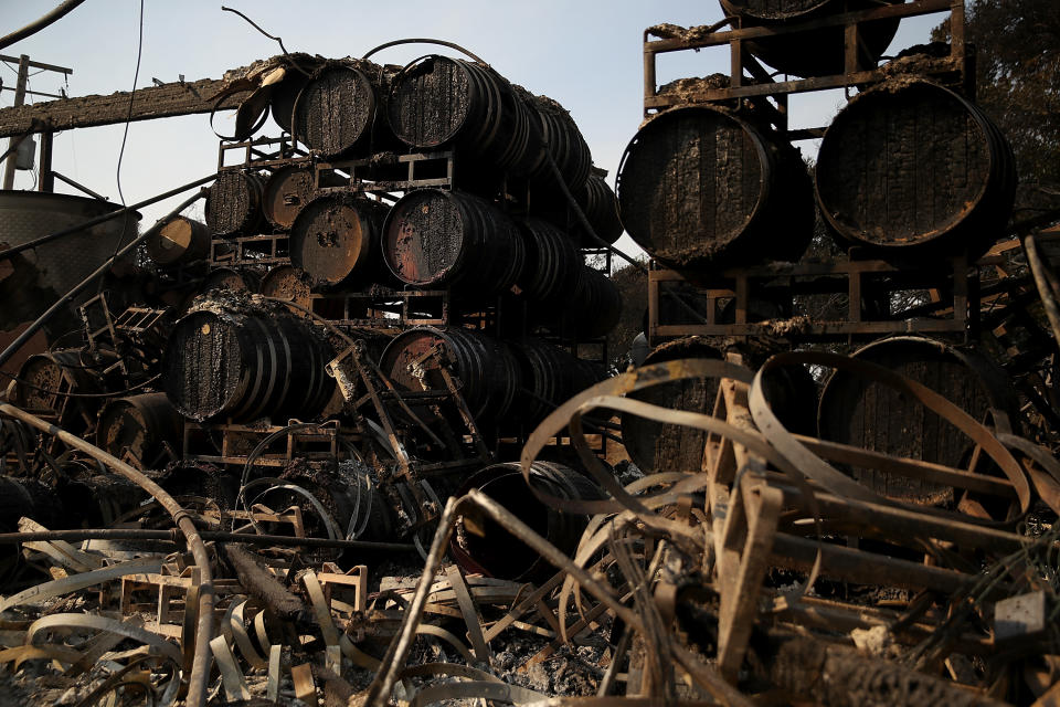 Charred wine barrels sit on racks at Paradise Ridge Winery after being destroyed by the Tubbs fire on Oct. 11 in Santa Rosa, Calif. (Photo: Justin Sullivan/Getty Images)