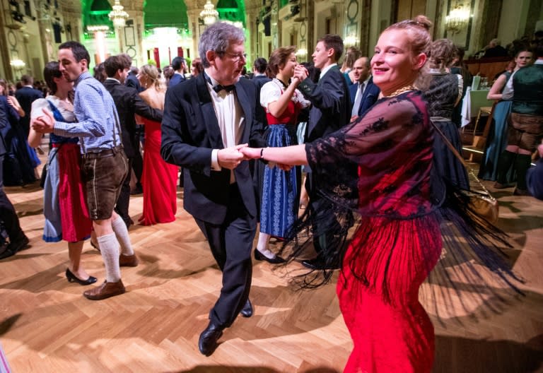 Edgar Kogler, a 49-year-old "taxi dancer", dances with a partner during a ball at the Hofburg palace in Vienna. Some 450 balls are organised in the Austrian capital through the winter