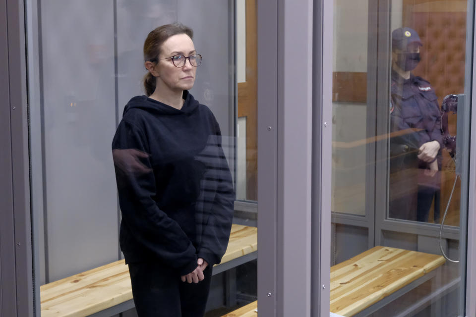 Radio Free Europe-Radio Liberty's editor Alsu Kurmasheva stands in a glass cage in a courtroom in Kazan, Russia, Thursday, Feb. 1, 2024. A Russian court on Thursday ordered a detained Russian-American journalist to be held in jail for two more months pending her trial on charges of failing to register as a foreign agent. (AP Photo/Vladislav Mikhnevskii)