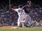 Tampa Bay Rays' Brett Phillips, right, reaches first on a wild pitch as Boston Red Sox first baseman Bobby Dalbec (29) takes a late throw during the eighth inning of a baseball game at Fenway Park, Monday, July 4, 2022, in Boston. (AP Photo/Mary Schwalm)