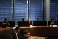 Olaf Scholz, Federal Minister of Finance and SPD top candidate for chancellor at the forthcoming General election, sits on the Finance Committee of the Bundestag in Berlin, Germany, Monday, Sept. 20, 2021. Scholz is to answer questions about the search of his ministry in connection with money laundering investigations. (Carsten Koall/dpa via AP)