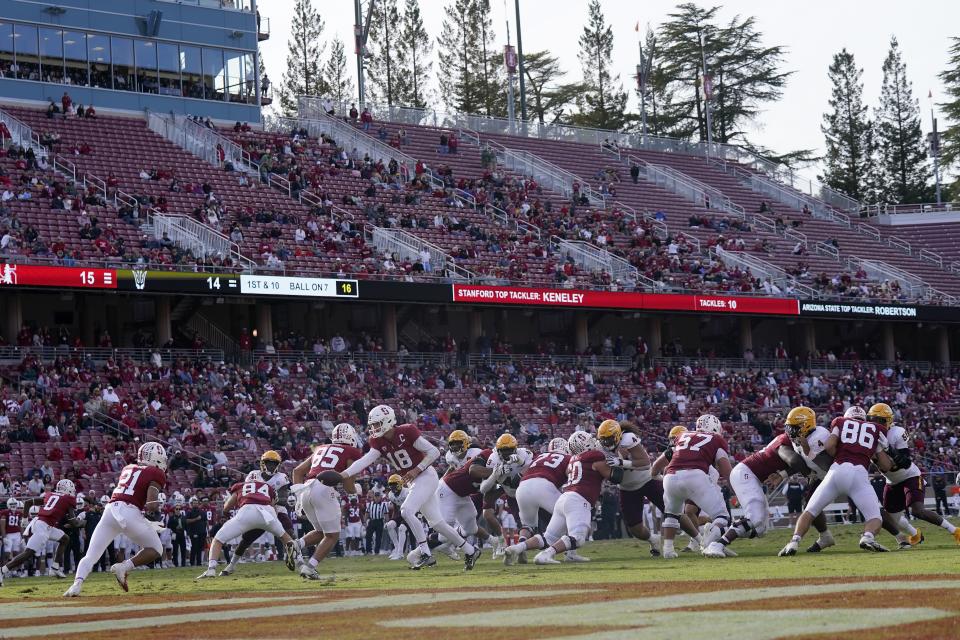 Stanford quarterback Tanner McKee (18) hands off to running back Caleb Robinson (21) during game against Arizona State in Stanford, Calif., Saturday, Oct. 22, 2022. | Jeff Chiu, Associated Press